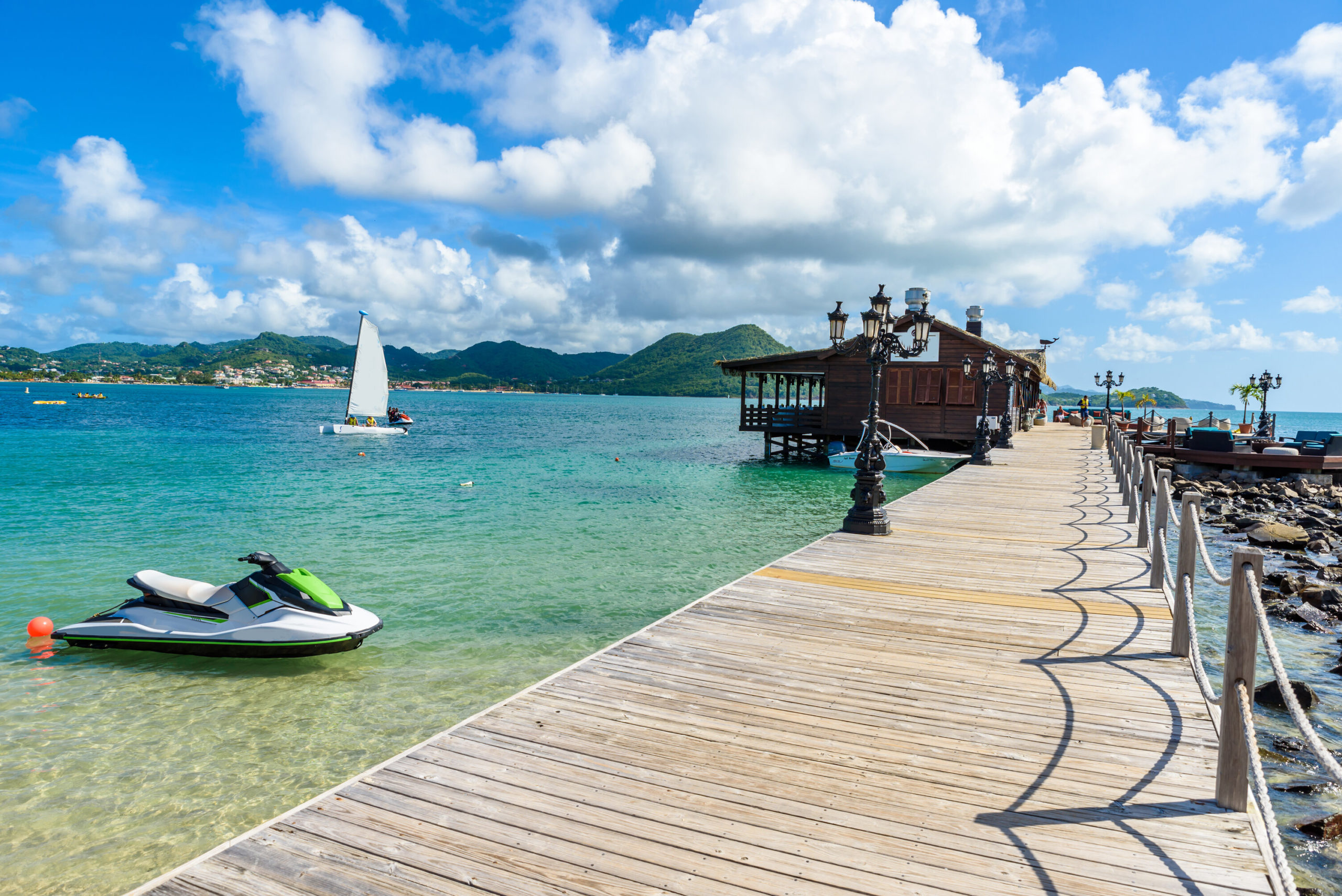 Pigeon Island Beach - tropical coast on the Caribbean island of St. Lucia. It is a paradise destination with a white sand beach and turquoiuse sea.